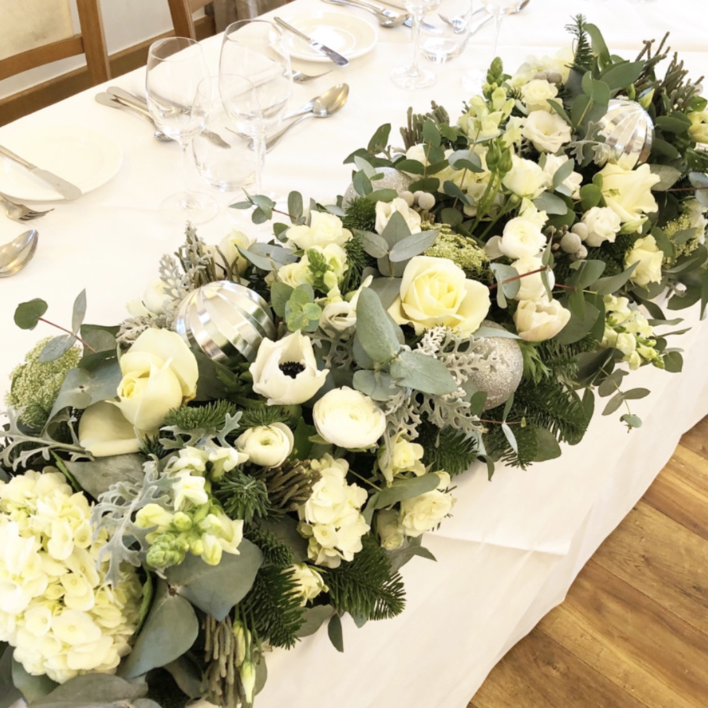 White and green top table arrangement